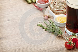 Grilled sausages with mug of beer