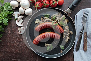 Grilled sausages with mushrooms