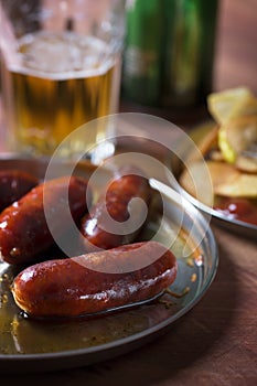 Grilled sausages prepared on grill