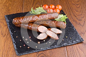 Grilled sausages on slate plate