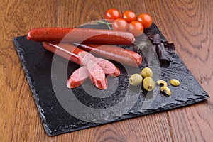 Grilled sausages on slate plate
