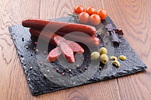 Grilled sausages on slate plate