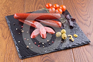 Grilled sausages on slate plate