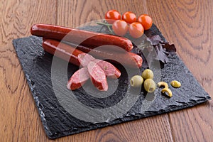 Grilled sausages on slate plate