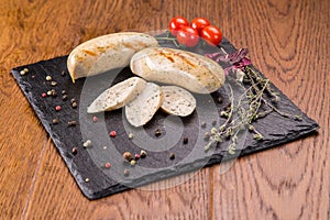 Grilled sausages on slate plate