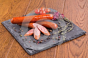 Grilled sausages on slate plate