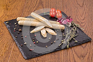 Grilled sausages on slate plate