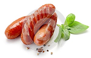 Grilled sausages on white background