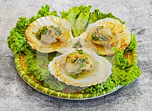 Grilled scallops with green onion or so diep nuong mo hanh, xao phomai served in dish isolated on grey background top view of