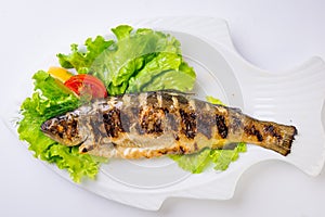 Grilled sea fish from above.