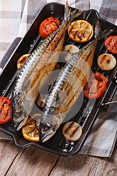 Grilled sea fish and vegetables in a pan grill, vertical top vie