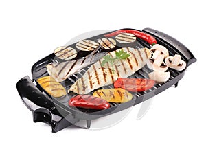 Grilled seabass on grill with vegetables