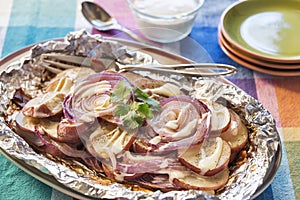 Grilled seasoned red potatoes and onions drizzled with ranch dressing