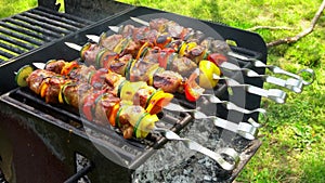 Grilled shish kebab on metal skewer. Chef cooking