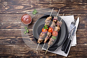 Grilled shish kebab skewers  with tomatoes