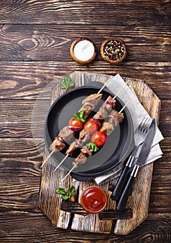 Grilled shish kebab skewers with tomatoes