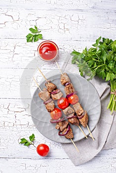 Grilled shish kebab skewers with tomatoes
