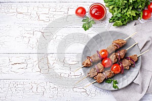 Grilled shish kebab skewers with tomatoes