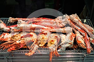 Grilled shrimp and crabs at Kuromon Ichiba Market, Osaka, Japan