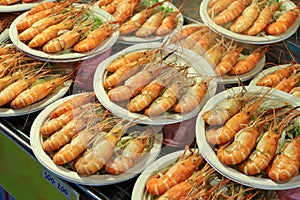 Grilled shrimp on a paper plate