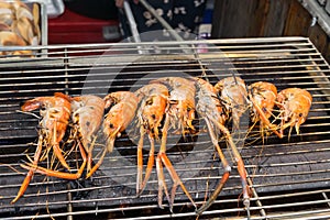 Grilled shrimps, prawns on the flaming grill