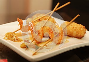 Grilled shrimps with rice on white plate