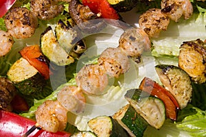 Grilled shrimps and veggies kebab skewers