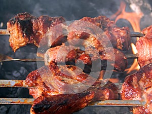 Grilled skewers with smoke and grease