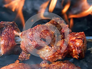 Grilled skewers with smoke and grease