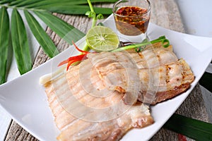 Grilled slices of pork belly with spicy sauce