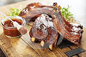 Grilled and smoked ribs with barbeque sauce photo