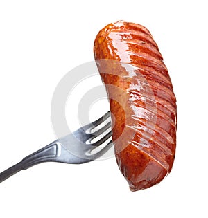 Grilled sausage on a fork