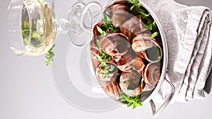 Grilled snails , cooking barbecue seafood with pesto sauce. French cuisine. Vertical video, ideal for social media and