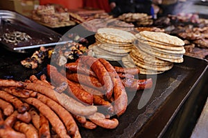 Grilled sousage, different tipe of meat and pita bread. photo