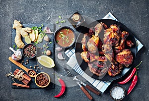 Grilled spicy Jerk Chicken drumsticks and thighs