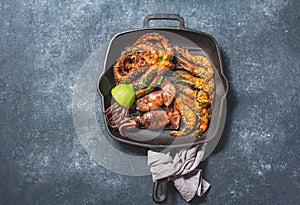 Grilled spimps, squids and octopus in cast iron grill pan