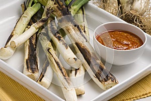 Grilled spring onions.Spanish cuisine.
