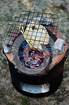Grilled squid on a charcoal stove