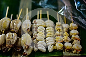 Grilled squid eggs for sale at Ban Chong Samaesan Seafood Market photo