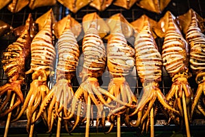 Grilled squid skewers on bamboo sticks for sale in Naklua Market, Pattaya