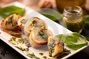 Grilled squid stuffed with basil pesto sauce