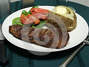 Grilled Steak dinner with utensils