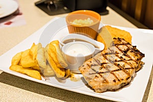 Grilled steak, French fries.