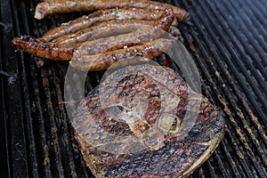 Grilled steak,traditional sousage and different tipe of meat. photo