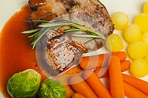 Grilled steak with vegetables, carrot,  potatoe and  brussels sprout