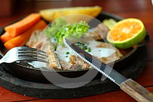 Grilled steaks, baked potatoes and vegetables