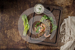 Grilled surf and turf on wooden board