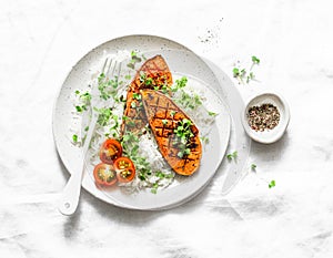 Grilled sweet potatoes with crunchy rice and micro greens on light background. Vegetarian healthy food concept