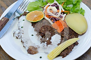 Grilled t-bone steak and vegetables
