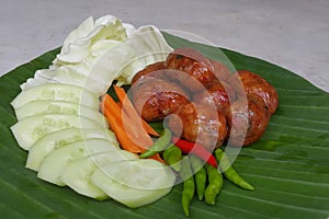 Grilled Thai style spicy pork susage.